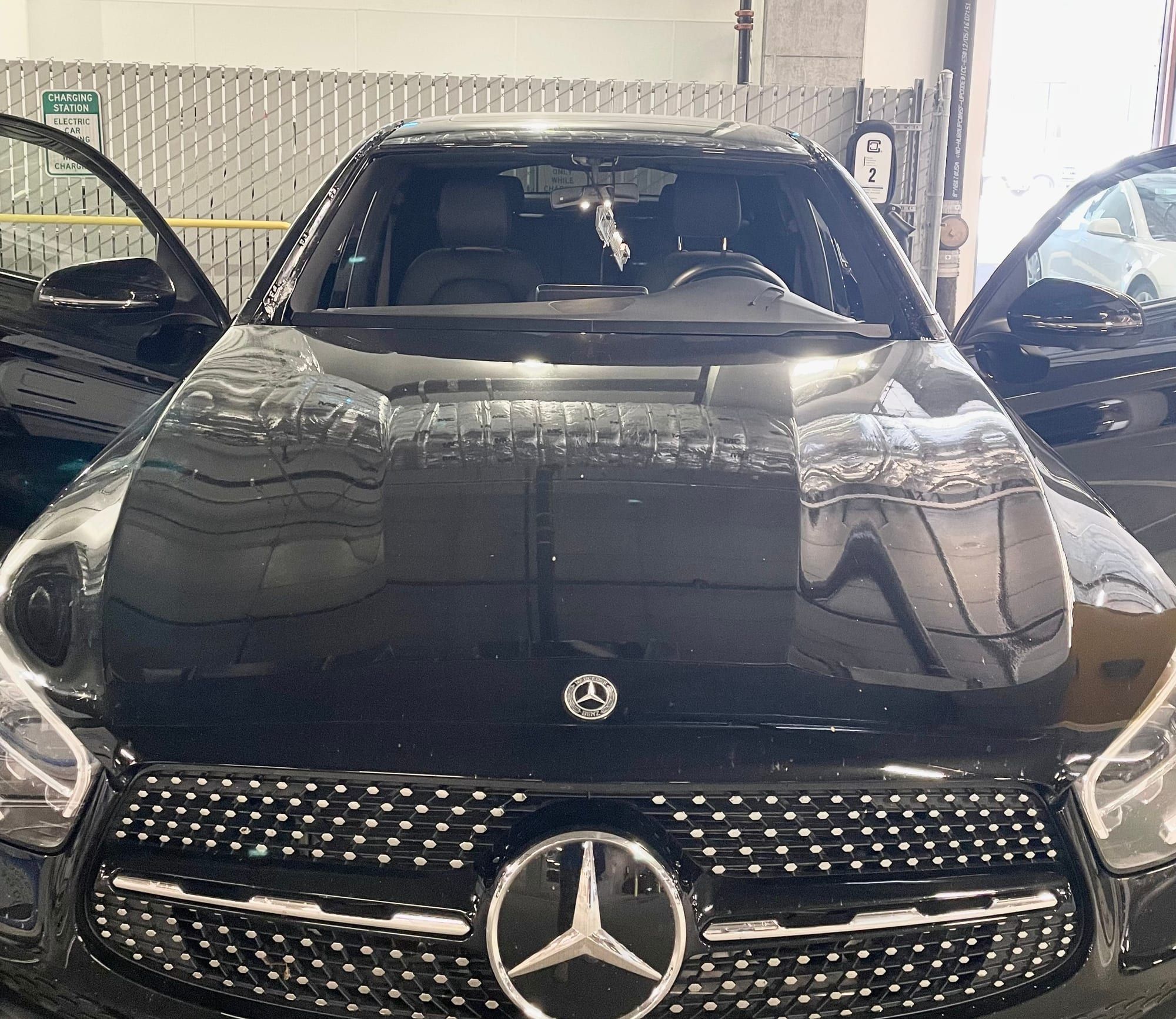 Black Mercedes-Benz with a newly installed windshield