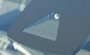 A windshield camera in a housing behind the rearview mirror